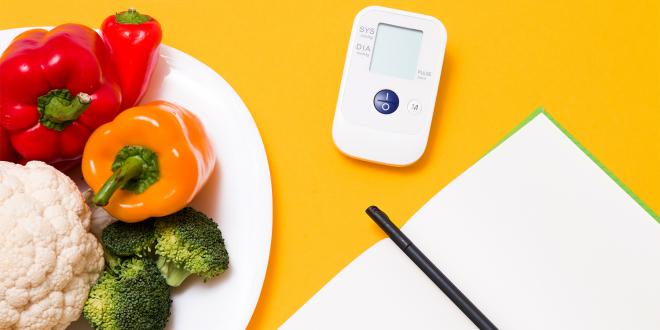 a journal, a blood pressure monitor, and a diet journal