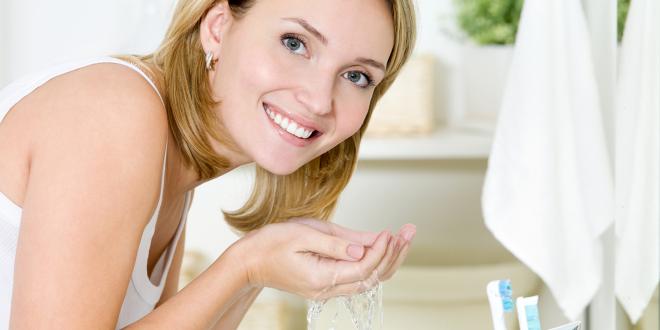 Woman washing her face