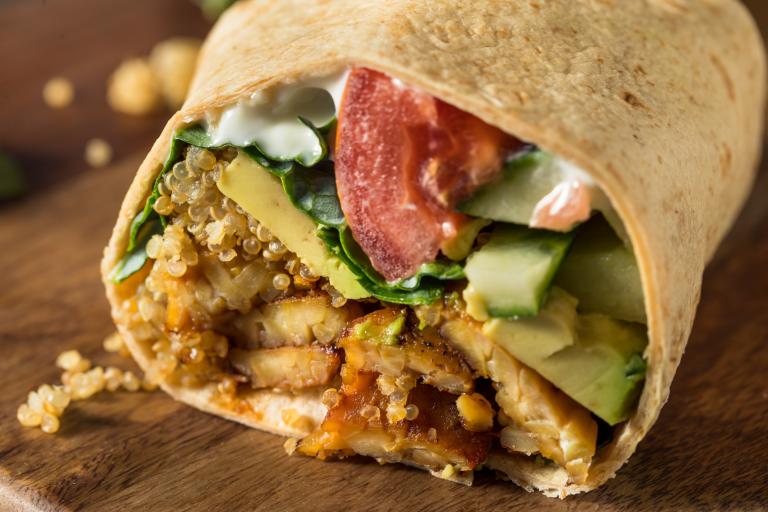 Tempeh veggie wrap, shot from the front so ingredients are displayed.